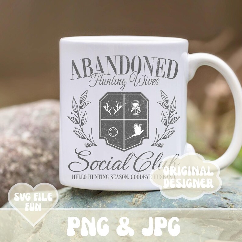 May include: White ceramic mug with a black and grey design that says "Abandoned Hunting Wives Social Club" and "Hello Hunting Season, Goodbye Husband".