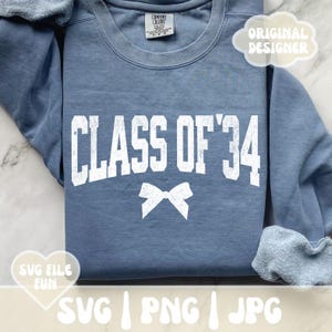 May include: A blue sweatshirt with the text "CLASS OF '34" in white block letters and a white bow graphic. The sweatshirt has a crew neck and long sleeves. The words "ORIGINAL DESIGNER" and "SVG FILE FUN" are also visible.