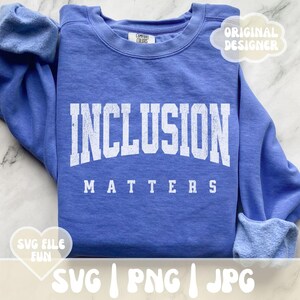 May include: A blue sweatshirt with the text "INCLUSION MATTERS" in white lettering. The sweatshirt is a popular item for promoting inclusivity and social justice.