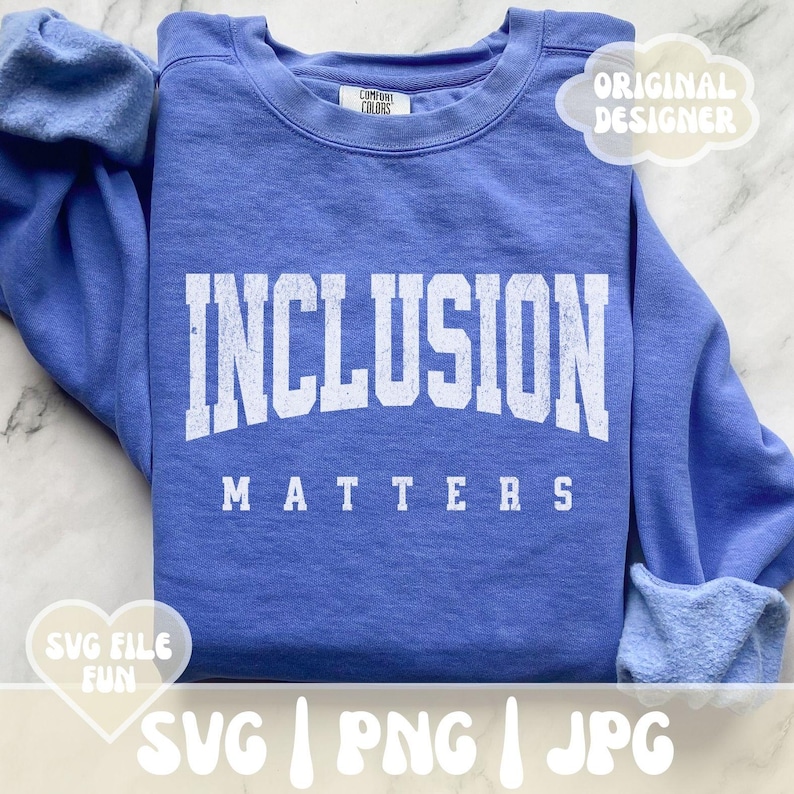 May include: A blue sweatshirt with the text "INCLUSION MATTERS" in white lettering. The sweatshirt is a popular item for promoting inclusivity and social justice.
