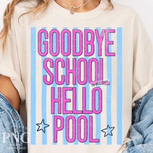 May include: Cream-colored t-shirt with the words "GOODBYE SCHOOL HELLO POOL" in pink, outlined in a darker pink. The text is set against a backdrop of light blue vertical stripes. Two blue stars flank the word "POOL".