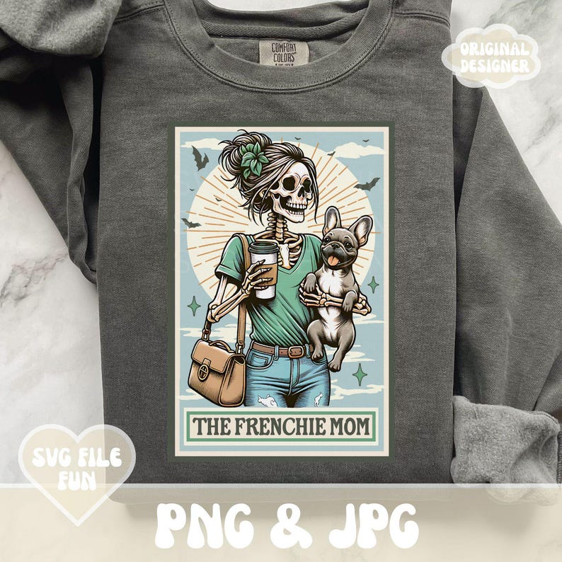 May include: Dark gray sweatshirt with a graphic featuring a skeleton holding a coffee cup and a French Bulldog. The design includes the text "THE FRENCHIE MOM" and is surrounded by bats and a light blue background.