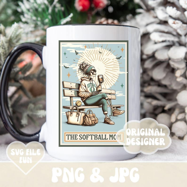 May include: White ceramic mug with a black handle and a black rim. The mug features a colorful illustration of a skeleton sitting on a bench with a coffee cup and a baseball. The text "The Softball Mom" is printed on the mug.