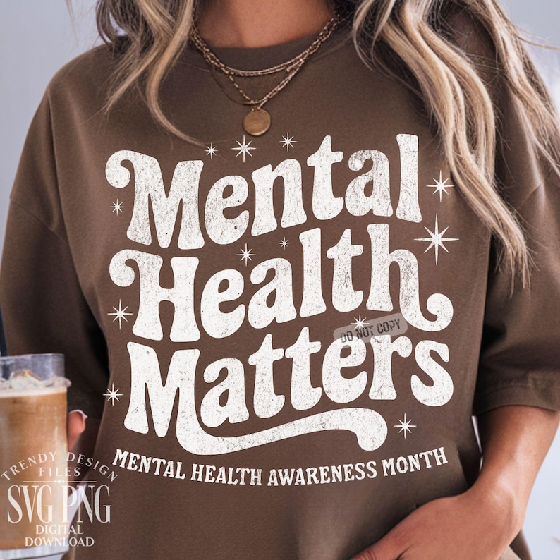May include: A brown sweatshirt with the text "Mental Health Matters" in white, with starburst accents. The phrase "Mental Health Awareness Month" is printed below. The design is a digital download.