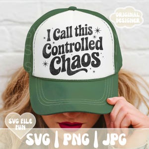 May include: A green and white trucker hat with the text "I Call this Controlled Chaos" in black. The hat has a curved brim and a mesh back. The words "SVG FILE FUN" and "SVG | PNG | JPG" are also visible.