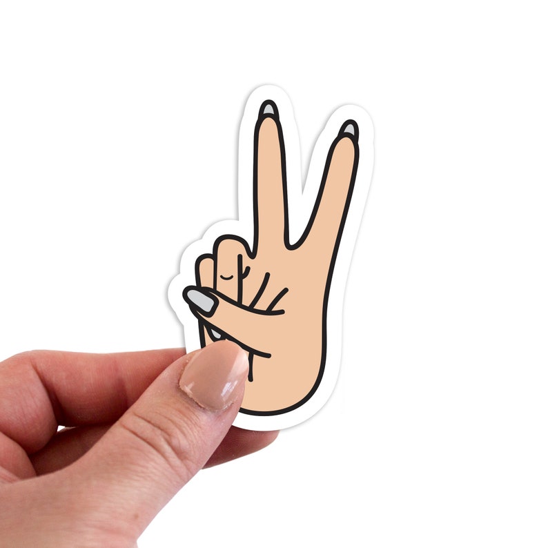 May include: A sticker of a hand making the peace sign with two fingers raised. The hand is light pink with white nail polish on the fingers.