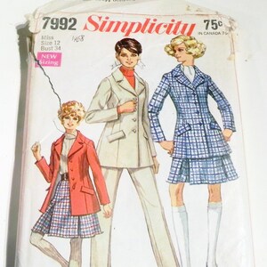 May include: Vintage Simplicity sewing pattern, size 12, featuring illustrations of women's suits and dresses. The pattern includes a red blazer, a cream-colored suit, and a blue plaid suit with a matching skirt. The pattern is from 1968.