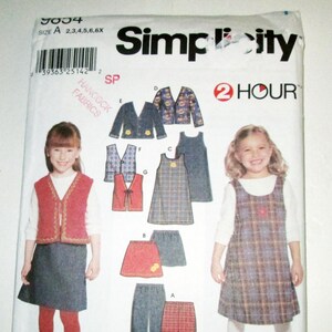 May include: Simplicity sewing pattern for girls' clothing, size A. The pattern includes options for dresses, vests, jackets, skirts, and pants. The package features illustrations of the finished garments and the text "2 Hour".