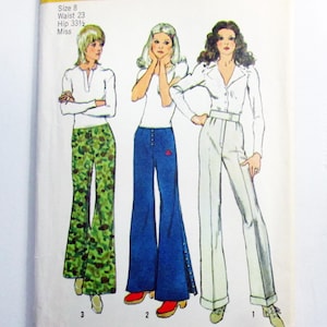 May include: Vintage Simplicity sewing pattern 9820 featuring three flared pants designs. The pattern includes measurements for a size 8, with a 23-inch waist and 33.5-inch hips. The cover has a yellow banner with the Simplicity logo and price.