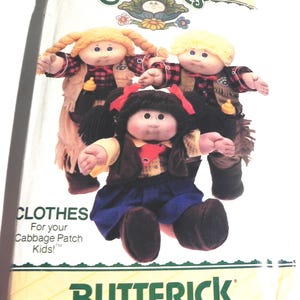 May include: A Butterick sewing pattern envelope for Cabbage Patch Kids clothes, number 6826. The cover features three dolls wearing outfits including a plaid shirt, a vest, a skirt, and boots. The text reads Cabbage Patch Kids, 6826, and CLOTHES For your Cabbage Patch Kids!