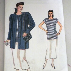 May include: A Very Easy Very Vogue sewing pattern envelope 9876 for sizes 8-10-12. The illustration shows two outfits: a dark blue jacket over a striped top and white skirt, and a striped top with a white skirt. Includes a bonus overlock sewing guide.