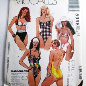 May include: A McCall's 5998 sewing pattern envelope for swimwear, size 12. The front displays illustrations of five different swimsuit styles, including a black and white gingham one-piece, a polka dot bikini, and a colorful geometric print one-piece.