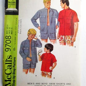 May include: Vintage McCall's pattern 9708 for boys' swim shorts and jacket. The cover features illustrations of the garments in blue and red, with shorts and a jacket. The pattern includes sizes for a chest of 26 inches and a waist of 23 inches.