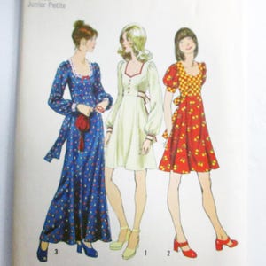 May include: Simplicity sewing pattern envelope featuring illustrations of three dresses. The envelope includes the text "5347 Simplicity" and "Size 7jp Bust 32 Junior Petite". The dresses are in blue, white, and red with floral and checkered patterns.