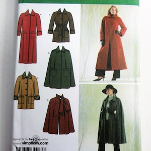 May include: Simplicity sewing pattern featuring various coat and cape designs. The pattern includes a long red coat, a brown belted coat, a green cape, a tan coat with brown trim, and a red cape with a scarf. The pattern size is K5, sizes 8, 10, 12, 14, and 16.