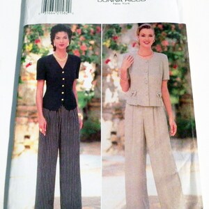 May include: A Butterick sewing pattern featuring two women's suits. One suit is a black top with gold buttons and striped pants. The other is a light beige suit with a short-sleeved jacket and matching pants. The pattern is by Donna Ricco, New York.
