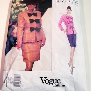 May include: A Vogue Patterns sewing pattern featuring a Givenchy design. The pattern packet shows a woman in a peach-colored suit with black bow accents. The design includes a jacket and skirt. The packet also shows a pink jacket and blue skirt.