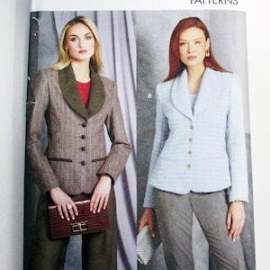 May include: Vogue Patterns R11908. The image shows two women modeling tailored suits. One suit is brown with a green collar, and the other is light blue. The pattern size is H5 (6-8-10-12-14). Designed and printed in the USA.