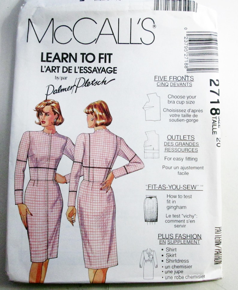 May include: A McCall's sewing pattern envelope, number 2718, size 20, titled Learn to Fit. The front displays illustrations of a dress in a pink and white gingham check pattern, featuring long sleeves, a high neckline, and a fitted silhouette.