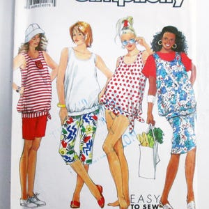 May include: A Simplicity 9723 sewing pattern envelope for size KK (8-14) featuring illustrations of four outfits including tank tops, shorts, capri pants, and a skirt. The cover displays the text Simplicity, 9723, and Easy to Sew.