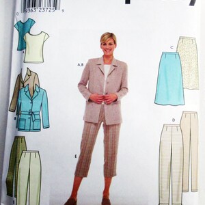 May include: A Simplicity sewing pattern envelope 9081 for sizes 14, 16, 18, 20. The front displays illustrations of a blazer, top, skirt, and trousers in various colors and patterns, alongside a photograph of a model wearing a beige blazer and trousers.
