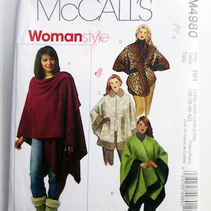 May include: A McCall's M4980 sewing pattern envelope for fleece wraps and ponchos. The cover features illustrations of three different styles labeled A, B, C, and D, showcasing a maroon wrap, a green wrap with black trim, and a leopard print cape.
