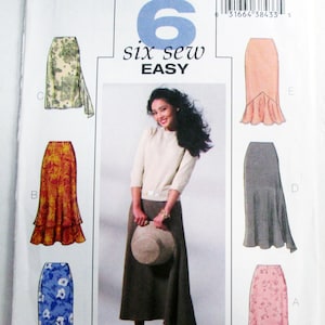 May include: A Butterick sewing pattern envelope, B4233, featuring six skirt designs. The cover includes a photo of a woman wearing a skirt, and illustrations of the skirt styles in various colors and patterns. The text "six sew easy" is also visible.