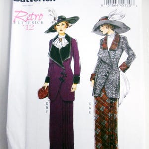 May include: A Butterick B6108 sewing pattern envelope featuring illustrations of two outfits. One is a solid purple long-sleeved jacket and skirt with a dark collar and hat. The other is a grey patterned jacket with a plaid skirt and matching hat.