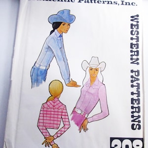 May include: A vintage sewing pattern package featuring illustrations of women in Western-style clothing. The package includes drawings of a woman in a blue shirt and jeans, and another in a pink shirt. The text "Authentic Patterns, Inc." and "Western Patterns" are visible.