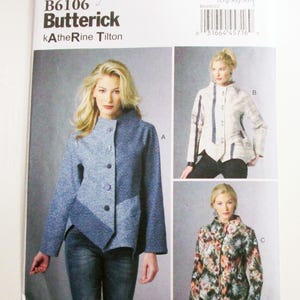 May include: A Butterick sewing pattern B6106 featuring three jacket designs. The main image shows a woman wearing a blue jacket with a geometric design. The pattern includes sizes Lrg-Xlg-XXL.