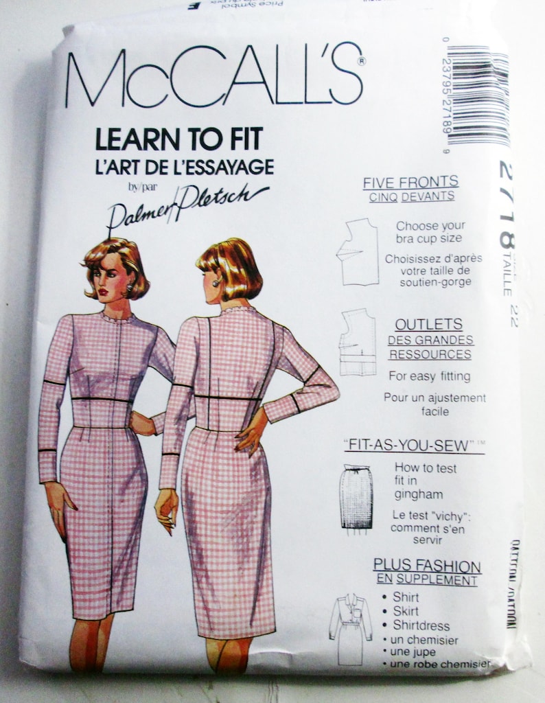 May include: A McCall's Learn to Fit sewing pattern envelope, number 2718, size 22. The white paper package features illustrations of a person wearing a long-sleeved, pink and white gingham dress with a high neckline and black seam detailing.