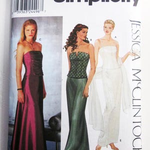 May include: Simplicity sewing pattern 9484 for Jessica McClintock formal gowns. The envelope displays three dress variations: a strapless magenta gown, a green quilted-bodice gown, and a white floor-length gown with thin straps and a wrap.