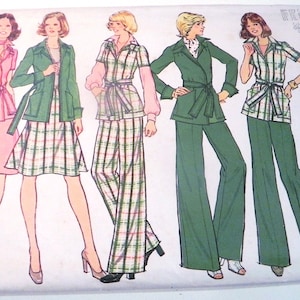 May include: Vintage Simplicity sewing pattern featuring illustrations of women's outfits. The designs include a pink skirt suit, a green jacket with a plaid skirt, and green pantsuits. The pattern cover has a blue and white border with the Simplicity logo.