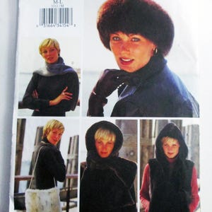 May include: A Butterick 3311 sewing pattern envelope featuring illustrations of various faux fur accessories including a round hat, a scarf, a hooded vest, and a rectangular shoulder bag. The pattern is sized M-L and includes a barcode on the front.