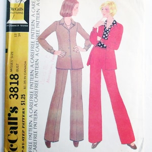 May include: Vintage McCall's 3818 sewing pattern for Misses' shirt-jacket and pants. The pattern features two women in 1970s-style outfits, one in a brown suit and the other in a red suit. The pattern is a Halston original.