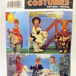 May include: A Simplicity 8586 sewing pattern envelope for costumes featuring children wearing various outfits including a gray horse, a white horse, a spotted horse, and a unicorn. The package displays the text Costumes and Pattern Patron.
