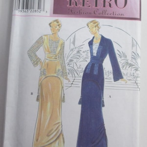 May include: Simplicity Retro Fashion Collection sewing pattern. The pattern features illustrations of two vintage dresses. One dress is a long, light gold gown with a detailed bodice. The other is a long, navy blue dress with a matching jacket. The pattern size is P 12, 14, 16.