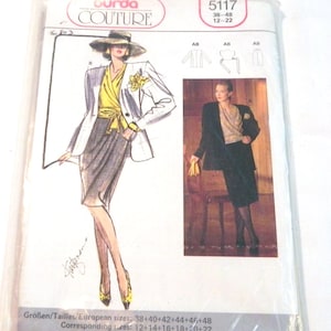 May include: A Burda Couture sewing pattern packet, model 5117, featuring illustrations of a woman in a suit. The packet includes a drawing of a woman wearing a white blazer, yellow top, and gray skirt. The packet is sealed in clear plastic.
