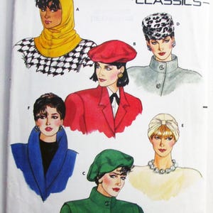 May include: Butterick 4065 Classics sewing pattern envelope featuring illustrations of six headwear styles: a yellow hood, a red beret, a green beret, a leopard print pillbox hat, a cream turban, and a blue coat with a high collar.