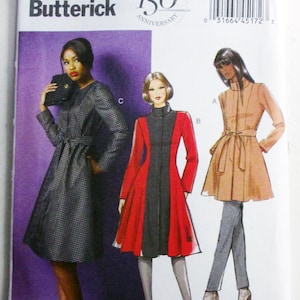 May include: Butterick sewing pattern B5966 featuring three coat designs. The illustrations show a black and white patterned coat, a red and black color-blocked coat, and a tan coat with a tie waist. The package includes size range 18W-24W.