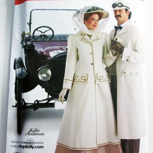 May include: Simplicity sewing pattern 2561 featuring vintage clothing designs. The pattern shows a woman and a man in cream-colored coats with gold trim, standing in front of a vintage car. The pattern includes sizes A-B/XS-XL.