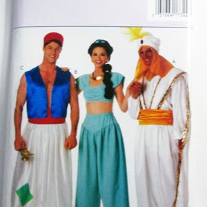 May include: Butterick sewing pattern 3048 featuring costume designs for three characters. The package displays illustrations of a blue vest with white pants, a teal two-piece outfit, and a white robe with a gold sash and turban with a feather.