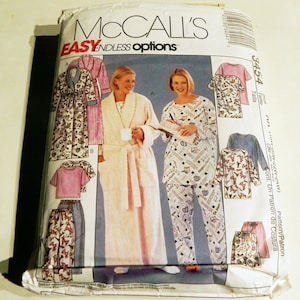 May include: McCall's sewing pattern package featuring illustrations of sleepwear and robes. The package includes images of a pink robe, pajamas, and a short-sleeved top and pants set. The text "EASY ENDLESS options" is visible on the package.