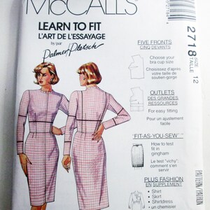 May include: A McCall's Learn to Fit sewing pattern envelope, number 2718, size 12. The front features illustrations of a person wearing a long-sleeved, pink and white gingham dress with a high neckline, along with instructional text and diagrams.