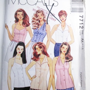 May include: A McCall's 7712 sewing pattern envelope featuring illustrations of six sleeveless button-front tops in various colors and patterns, including pink gingham, blue polka dot, white, and solid pastel shades, with size AX 4, 6, 8 listed.