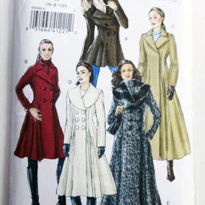 May include: A Vogue V8346 sewing pattern envelope featuring illustrations of five different coat styles. The designs include a short brown coat, a long red coat, a long white coat, a long leopard print coat, and a long beige coat with collars.