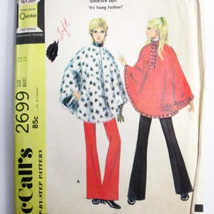 May include: A vintage McCall's sewing pattern envelope for a poncho and pants, number 2699. The illustration shows two outfits: one with a white and black spotted poncho and red pants, and another with a red poncho and black pants. Text includes SEVENTEEN says: It's Young Fashion!