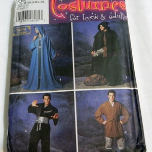May include: A Simplicity sewing pattern envelope 5840 for costumes for teens and adults. The package displays four costume variations: a blue hooded robe, a black hooded cloak, a black martial arts style outfit with a silver sash, and a brown tunic.