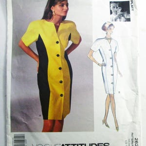 May include: Vogue Attitudes sewing pattern featuring a color-blocked dress design. The dress is yellow and black with large black buttons. The pattern includes a sketch of a white dress and a photo of Tom & Linda Platt. The pattern is size 6-8-10.