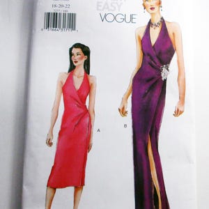 May include: Vogue pattern 7277 for dresses, sizes 18-20-22. The pattern features illustrations of two elegant dresses: a red knee-length dress and a purple floor-length gown with a high slit. The text "VERY EASY VOGUE" is visible.